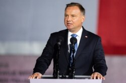 FILE - Polish President Andrzej Duda speaks to a crowd during an event in Gdansk-Westerplatte, Sept. 1, 2020.