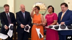 FILE - From left, Building and Land Technology Chairman Carl Kuehner, New Orleans Mayor Mitch Landrieu, Salamander Hotels & Resorts Founder & CEO Sheila C. Johnson, New Orleans City Council Member LaToya Cantrell, and Louisiana Lt. Gov. Billy Nungesser officially open NOPSI Hotel in New Orleans. Cantrell was elected mayor of New Orleans on Saturday.