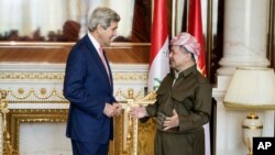 U.S. Secretary of State John Kerry, left, speaks with Kurdish regional President Massoud Barzani, ahead of a meeting in Irbil, Iraq, Tuesday, June 24, 2014.