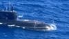 This handout photo taken on November 28, 2024 received on December 2, 2024 from the Armed Forces of the Philippines shows an aerial shot from an Armed Forces of the Philippines surveillance plane of a Russian Kilo-class submarine UFA 490 in the disputed South China Sea.