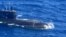 This handout photo taken on November 28, 2024 received on December 2, 2024 from the Armed Forces of the Philippines shows an aerial shot from an Armed Forces of the Philippines surveillance plane of a Russian Kilo-class submarine UFA 490 in the disputed South China Sea.