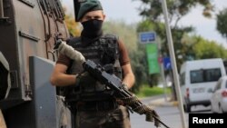 A police special forces member stands guard on a street in Istanbul, Turkey, July 18, 2016. 