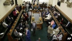 FILE — Members of the Zimbabwe parliament attend the house in Harare, Zimbabwe, May 5, 2020,