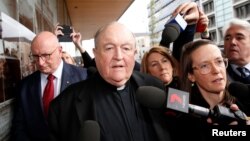 FILE - Archbishop Philip Wilson leaves Newcastle Local Court, in Newcastle for sentencing, Australia, July 3, 2018. 