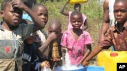 Children in Mwanza at one of the water taps