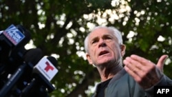 Peter Navarro, White House trade adviser to former U.S. President Donald Trump, speaks to the press at the Country Mall Plaza before reporting to the Federal Correctional Institution in Miami, Florida, on March 19, 2024.