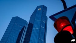 FILE - The headquarters of Deutsche Bank is seen in Frankfurt, Germany, Monday, May 18, 2020. A court in St. Petersburg has ordered the seizing of assets of Germany’s Deutsche Bank and Commerzbank in the country, the Russia state news agency Tass says.