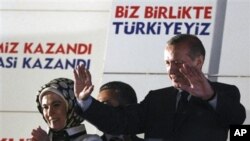 Turkish Prime Minister Recep Tayyip Erdogan addresses his supporters gathered in front of his Justice and Development Party headquarters in Ankara, Turkey, late Sunday, June 12, 2011.