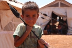 A boy is pictured at a camp in Idlib, Syria, July 24, 2020. A recent U.N. resolution will reduce the flow of humanitarian aid to northwestern Syria, say aid groups.