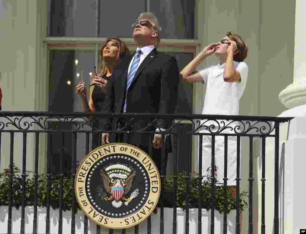 President Donald Trump, first lady Melania Trump and their son Barron watch the solar eclipse, Monday, Aug. 21, 2017, at the White House in Washington. (AP Andrew Harnik)