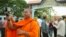 FILE - Luon Sovath, monk activist, is filming in front of Correctional Center 1 in the evening of 27th August, 2018 in Phnom Penh, Cambodia.