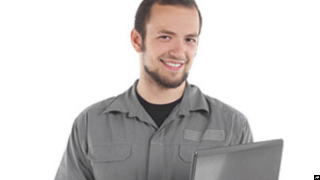 This young worker had better be checking his retirement account on that computer if he wants to be comfortable at age 65
