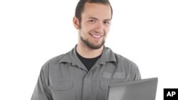 This young worker had better be checking his retirement account on that computer if he wants to be comfortable at age 65