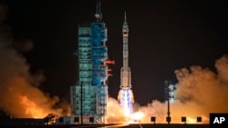 A Long March rocket with a Shenzhou-19 spacecraft atop takes off from the Jiuquan Satellite Launch Center in Jiuquan, northwestern China in the early hours of Oct. 30, 2024.