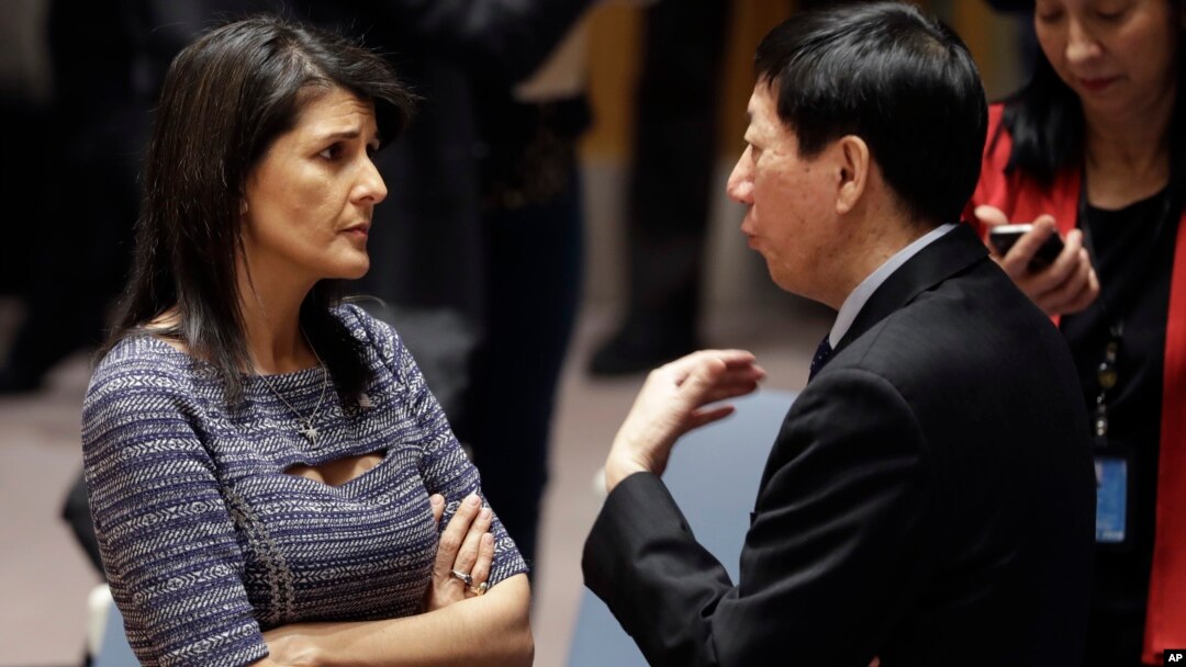 FILE - U.S. Ambassador to the United Nations Nikki Haley talks with Chinese Deputy Ambassador Wu Haitao, Dec. 22, 2017, at United Nations headquarters ahead of a council vote on proposed new sanctions against North Korea.