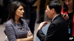 FILE - U.S. Ambassador to the United Nations Nikki Haley talks with Chinese Deputy Ambassador Wu Haitao, Dec. 22, 2017, at United Nations headquarters ahead of a council vote on proposed new sanctions against North Korea.