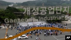 South Korean workers and owners who run factories in the stalled Kaesong industrial complex stage a rally insisting the normalize the operation of the industrial complex at the Imjingak Pavilion near the border village of Panmunjom in Paju, north of Seoul