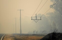 Burned power lines are seen in Mallacoota, Victoria, Australia, Jan. 10, 2020.