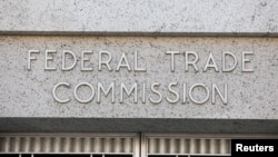 FILE - Signage is seen at the Federal Trade Commission headquarters in Washington, D.C., Aug. 29, 2020.