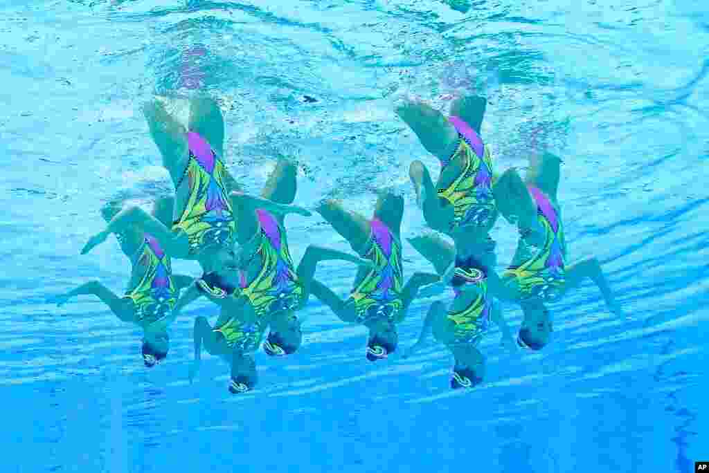 The Italy artistic swimming team competes during the team technical routine at the 2020 Summer Olympics, in Tokyo, Japan. 
