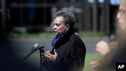 Chicago Mayor Lori Lightfoot speaks at a news conference in front of Wrigley Field in Chicago, April 16, 2020.