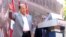 Lebanese Christian leader and founder of the Free Patriotic Movement (FPM) Michel Aoun greets his supporters during a rally to show support for him and to mark the October 13 anniversary, near the presidential palace in Baabda, near Beirut, Oct. 11, 2015.