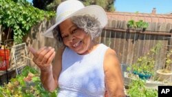 This photo shows Lagetta Wayne, 78, in her garden in Suisun City, Calif., on Aug. 10, 2021. Wayne is among a growing number of “grandfluencers,” folks 70 and up who are making names for themselves on social media. (KiKi Rose via AP)