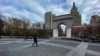 People walk around Washington square park as the coronavirus disease (COVID-19) outbreak continues in New York, U.S., March 22, 2020. 