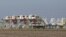 FILE - Idled drilling rigs owned by contractor Helmerich & Payne International Drilling Company sit on a lot in Seguin, Texas, Jan. 13, 2016.
