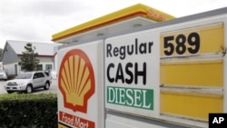 Gasoline priced at $5.89 for regular is advertised at a U.S. Shell station, Monday, Feb. 27, 2012, in Orlando, Florida. Oil prices are falling as investors lock in profits after a seven-day surge. 