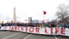 FILE - Participants in the March for Life march near the National Mall in Washington, Jan. 27, 2017. 