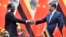 FILE: Zimbabwean President Emmerson Mnangagwa, left, shakes hands with Chinese President Xi Jinping as they pose for the media after a signing ceremony at the Great Hall of the People in Beijing, China.