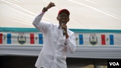 President Paul Kagame speaks at a rally outside of Kigali. (Z. Baddorf for VOA)