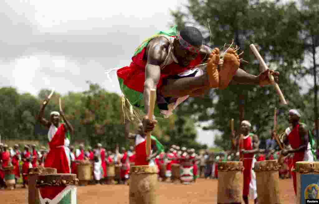 An artist jumps as traditional drummers perform the royal drum dance during a UNESCO-organized drum festival in Gitega, near the Burundian capital, Bujumbura.