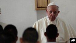 Pope Francis listens to the words of an inmate at the Las Garzas de Pacora detention center for minors before the start of a penitential Mass, in Panama, Jan. 25, 2019. 