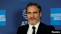 FILE PHOTO: Actor Joaquin Phoenix poses backstage after receiving the Chairman’s Award for Joker, at the 2020 Palm Springs International Film Festival Awards Gala in Palm Springs