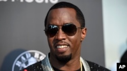 FILE - Sean 'Diddy' Combs arrives at the Los Angeles premiere of "Can't Stop, Won't Stop: A Bad Boy Story" at the Writers Guild Theater. He admitted that he beat his ex-girlfriend Cassie in a hotel hallway in 2016 after CNN released video of the attack.