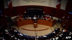 FILE - Mexican Foreign Minister Luis Videgaray (C) delivers a speech on relations with the United States in the Mexican Senate, Feb. 28, 2017, in Mexico City.