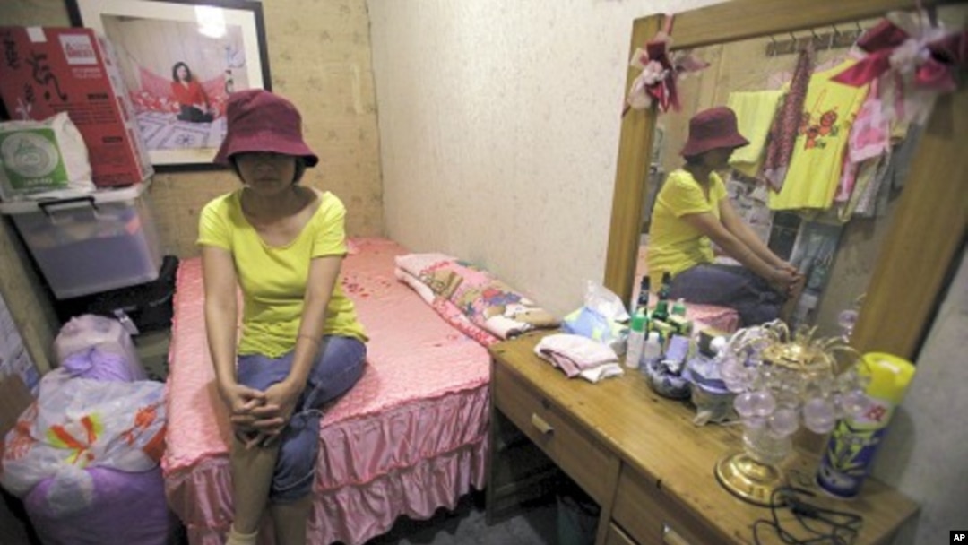 Taiwan-born sex worker Niko, 47, poses for a photograph after an interview with Reuters inside a brothel in Taipei (file photo)