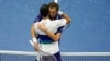 Daniil Medvedev, of Russia, right, hugs Novak Djokovic, of Serbia, after defeating Djokovic during the men's singles final of the US Open tennis championships, Sept. 12, 2021, in New York.