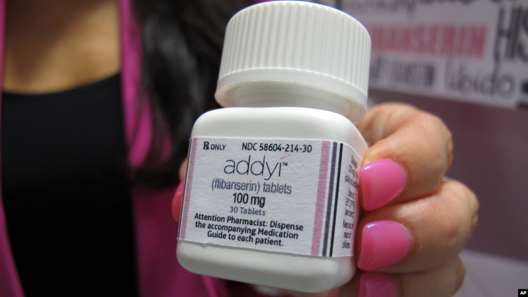 Sprout Pharmaceuticals CEO Cindy Whitehead holds a bottle for the female sex-drive drug Addyi at her Raleigh, N.C., Aug. 18, 2015.