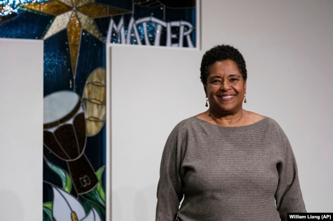 Rev. Chineta Goodjoin, who has started a string orchestra to promote young musicians of color, poses for a portrait in the sanctuary of New Hope Presbyterian Church on Wednesday, Oct. 16, 2024, in Anaheim, Calif. (AP Photo/William Liang)