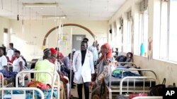 FILE—Julian Abeso walks around sickle cell patients ward at the Mbale Regional Referral Hospital in Mbale, Uganda, April 24, 2024.