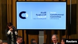 U.N. Special Envoy for Syria Geir Pedersen talks with members of Syrian delegations after the first meeting of the new Syrian Constitutional Committee at the United Nations in Geneva, Switzerland, Oct. 30, 2019.