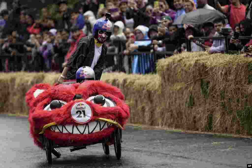 Participants complete a homemade gravity-powered vehicles race in Bogota, Colombia, Sept. 29, 2024.