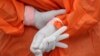 A health worker holds a glove outside the San Jose public hospital emergencies entrance, amid the spread of the coronavirus disease (COVID-19) in Santiago, Chile May 28, 2020. REUTERS/Ivan Alvarado TPX IMAGES OF THE DAY