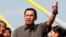 Cambodia's Prime Minister Hun Sen, center, gestures during a ceremony inaugurating the country's longest bridge in Neak Loeung, southeast of Phnom Penh, Cambodia, Wednesday, Jan. 14, 2015. Hun Sen, Cambodia's tough and wily prime minister, marks 30 years 