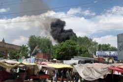 Smokes rises from a hospital after gunmen attacked in Kabul, Afghanistan, May 12, 2020.