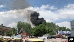 Smokes rises from a hospital after gunmen attacked in Kabul, Afghanistan, May 12, 2020. 