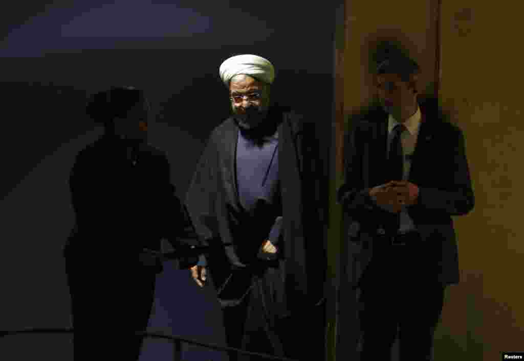 Iranian President Hassan Rouhani is escorted to the podium for his address to the 69th United Nations General Assembly at United Nations Headquarters in New York, Sept. 25, 2014. 